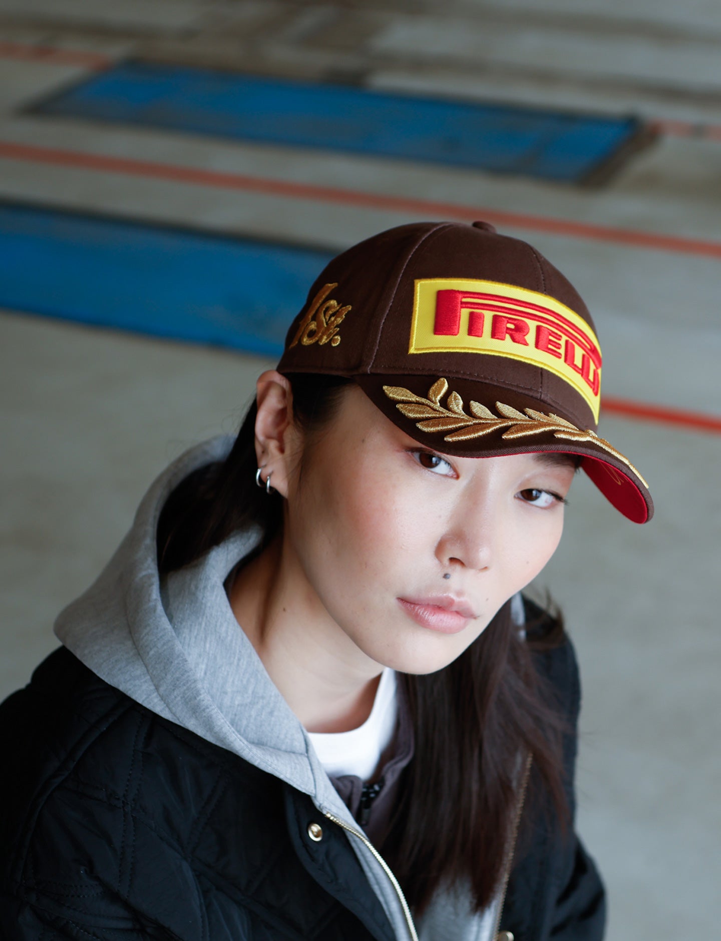 woman in Brown Pirelli Podium Cap