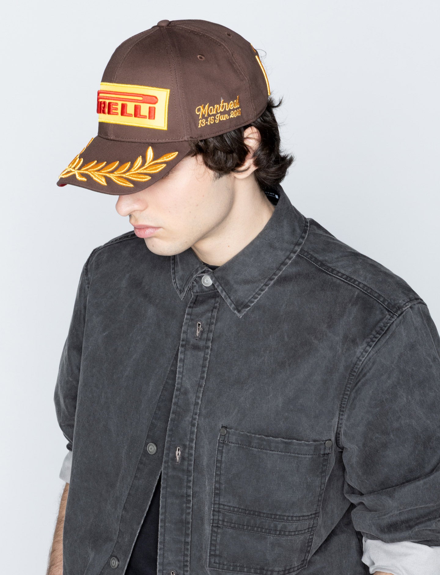 man in Brown Pirelli Podium Cap