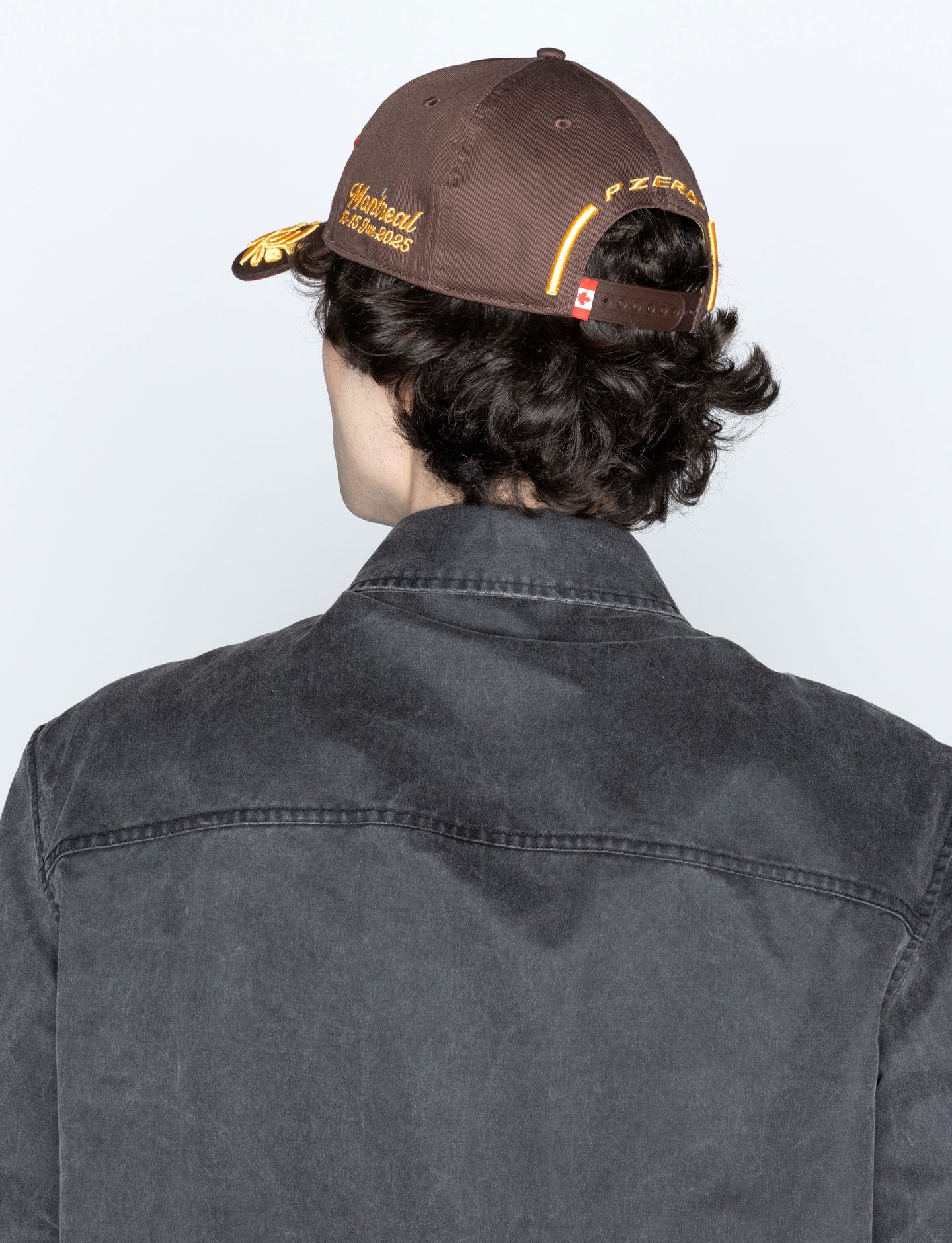 man in Brown Pirelli Podium Cap