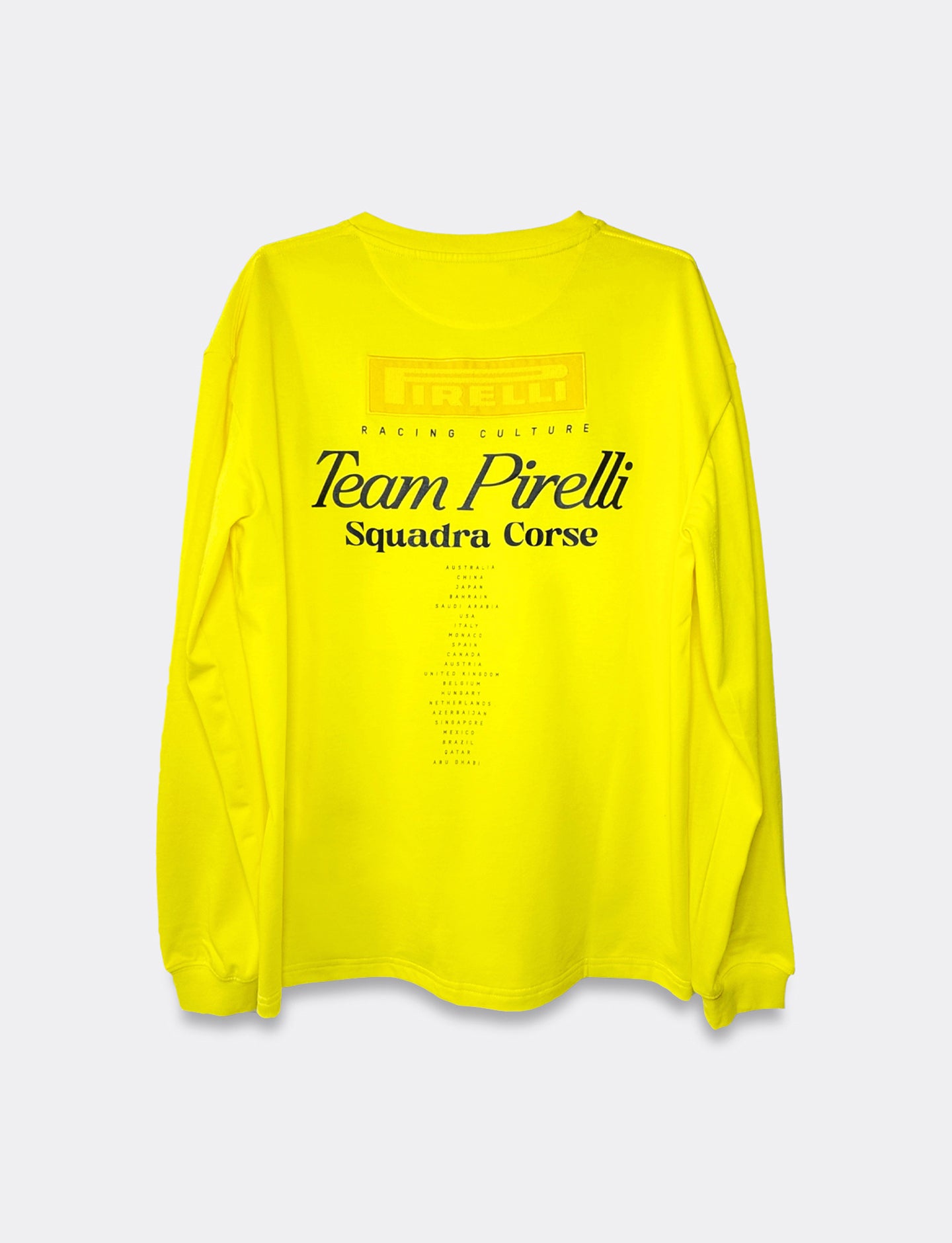 Yellow long-sleeve shirt with 'Team Pirelli Squadra Corse' text on a light gray background