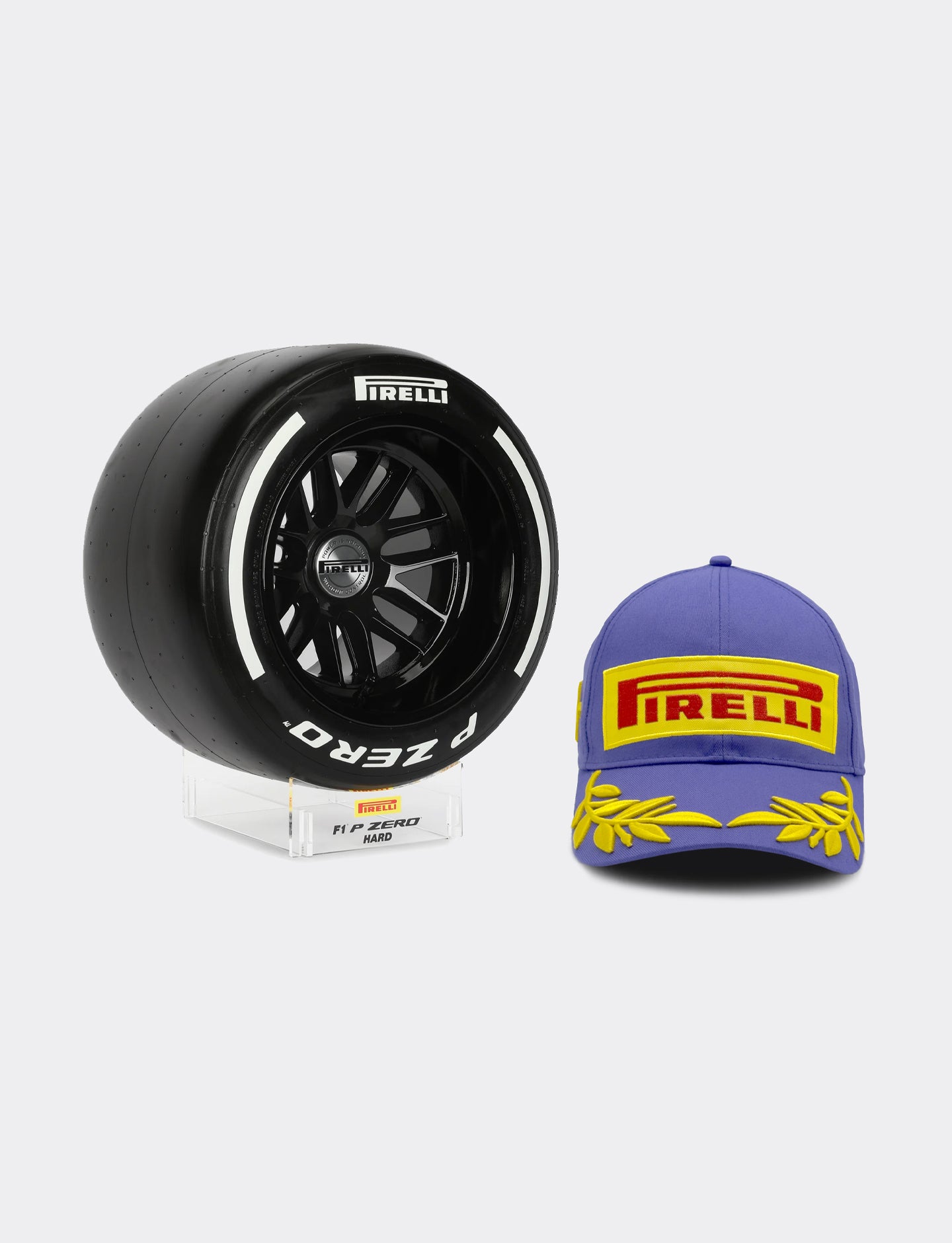 Pirelli model tyre next to a purple Pirelli podium cap