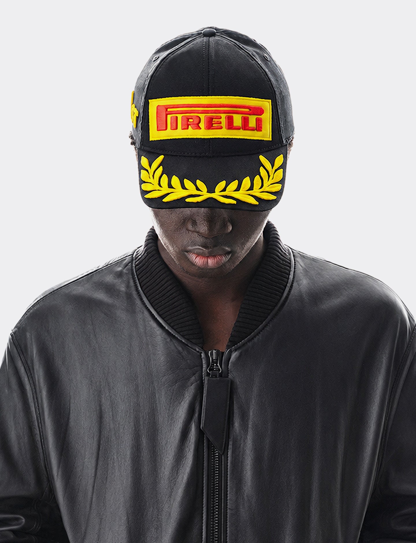 Person wearing a black Pirelli Podium Cap 2026 Formula 1® F1® Grand Prix