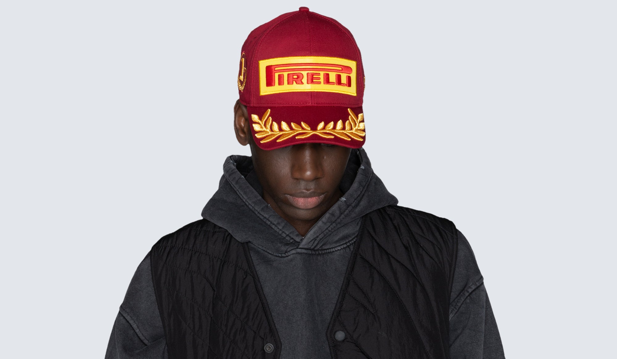 image of man in red Pirelli China cap