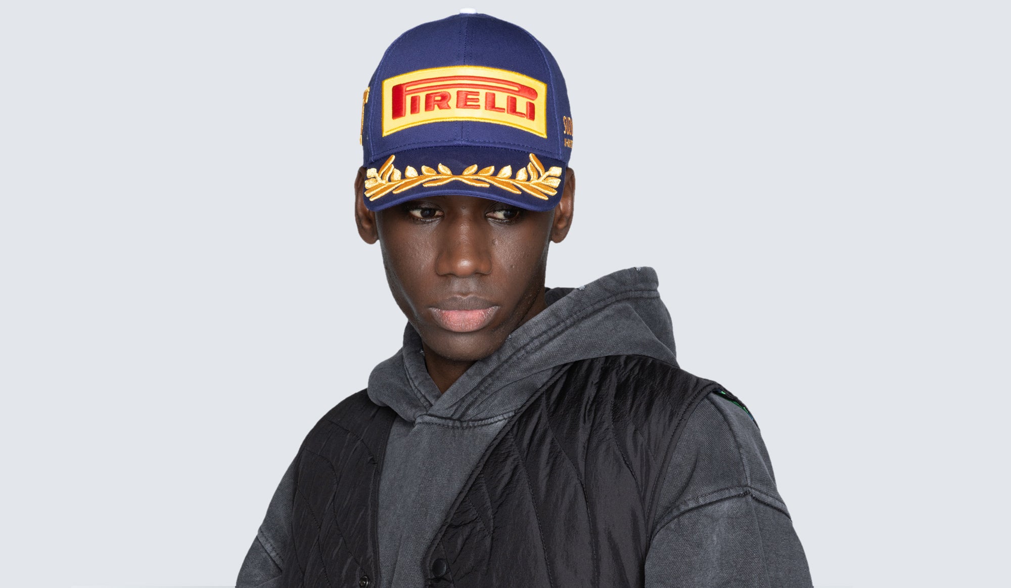 man in blue Pirelli cap front view