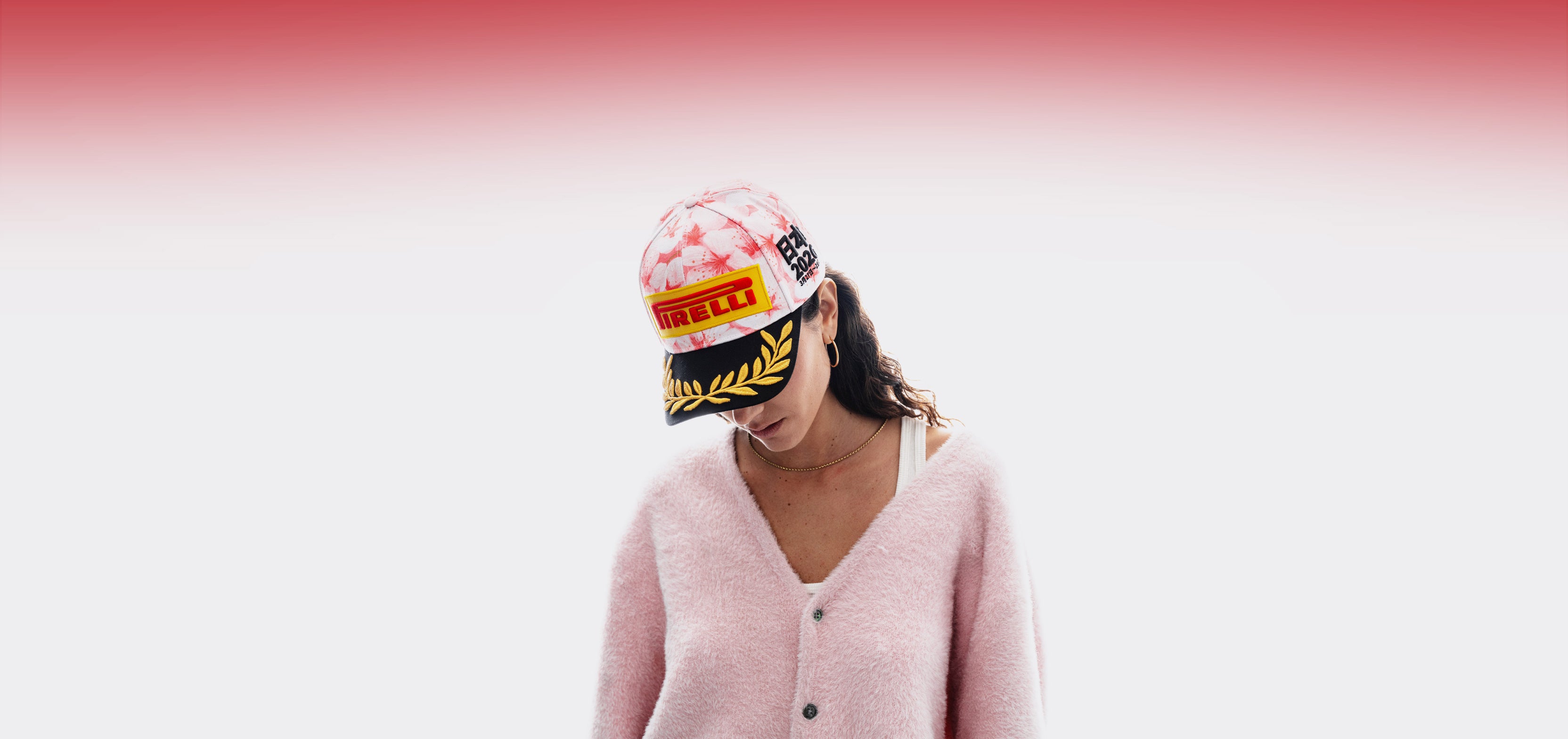 woman wearing a cherry blossom Pirelli Podium Cap