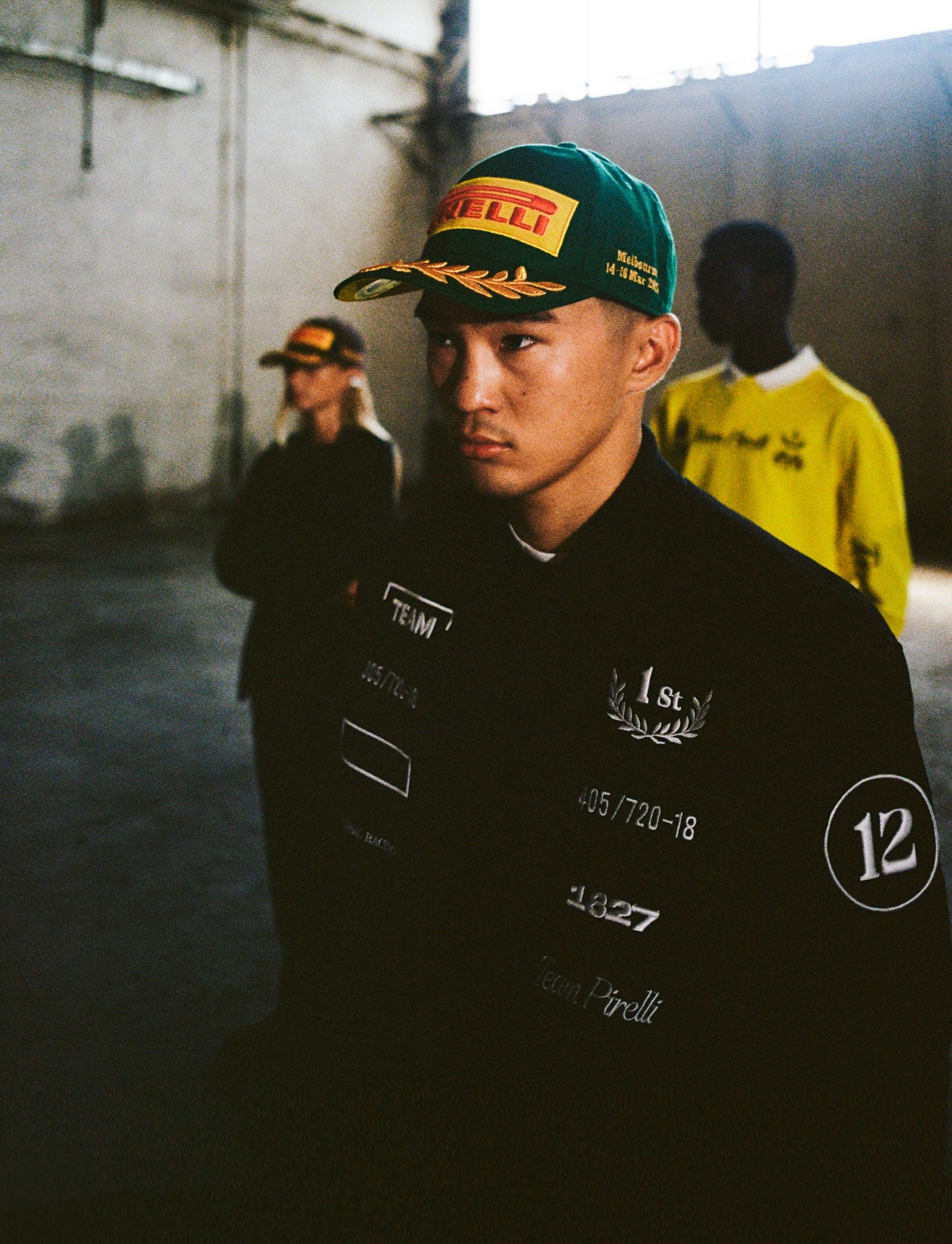 3 people wearing Pirelli apparel