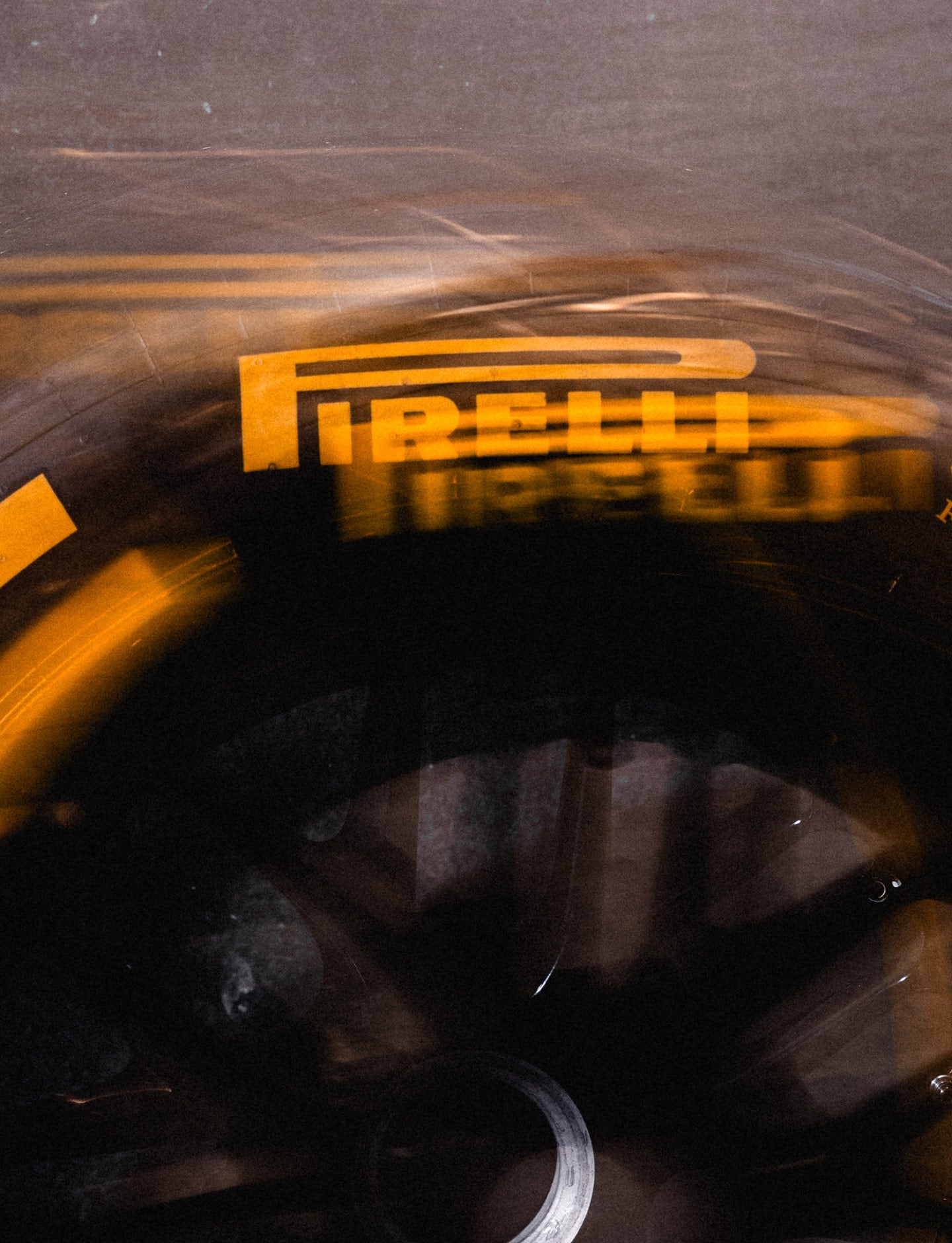 Close-up of a tire with Pirelli branding on a dark background