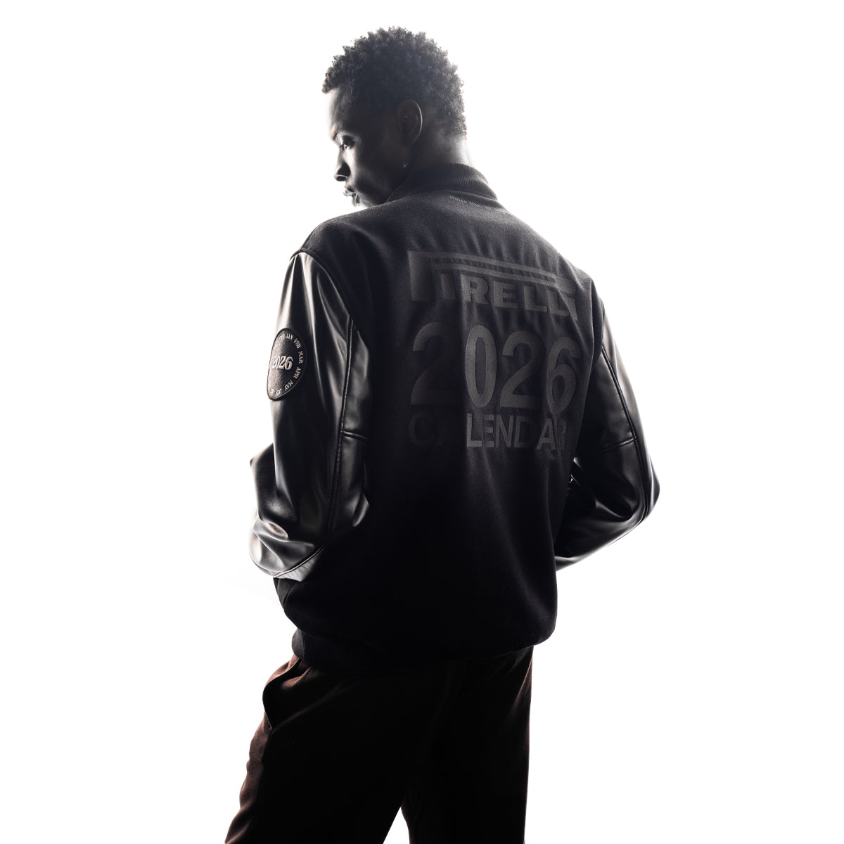 back shot of man wearing a Pirelli The Cal black jacket