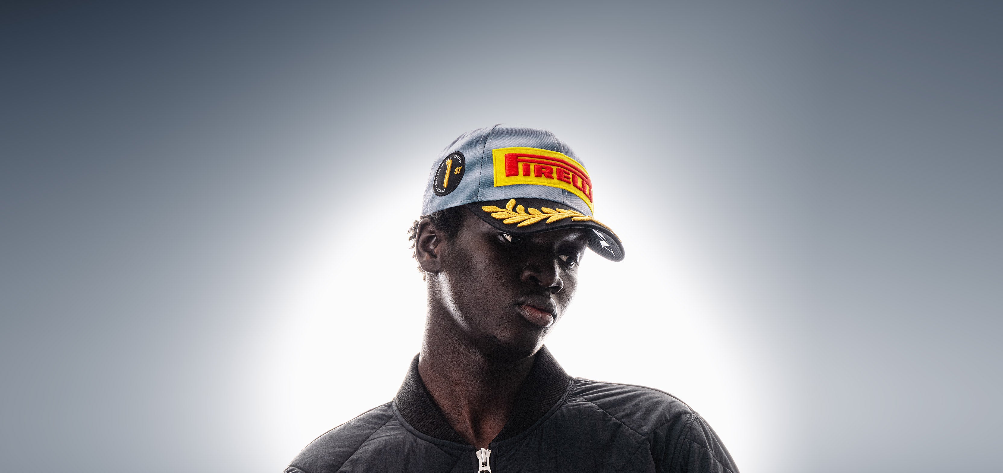 Person wearing an F1® Pirelli Podium Cap 2026 Miami