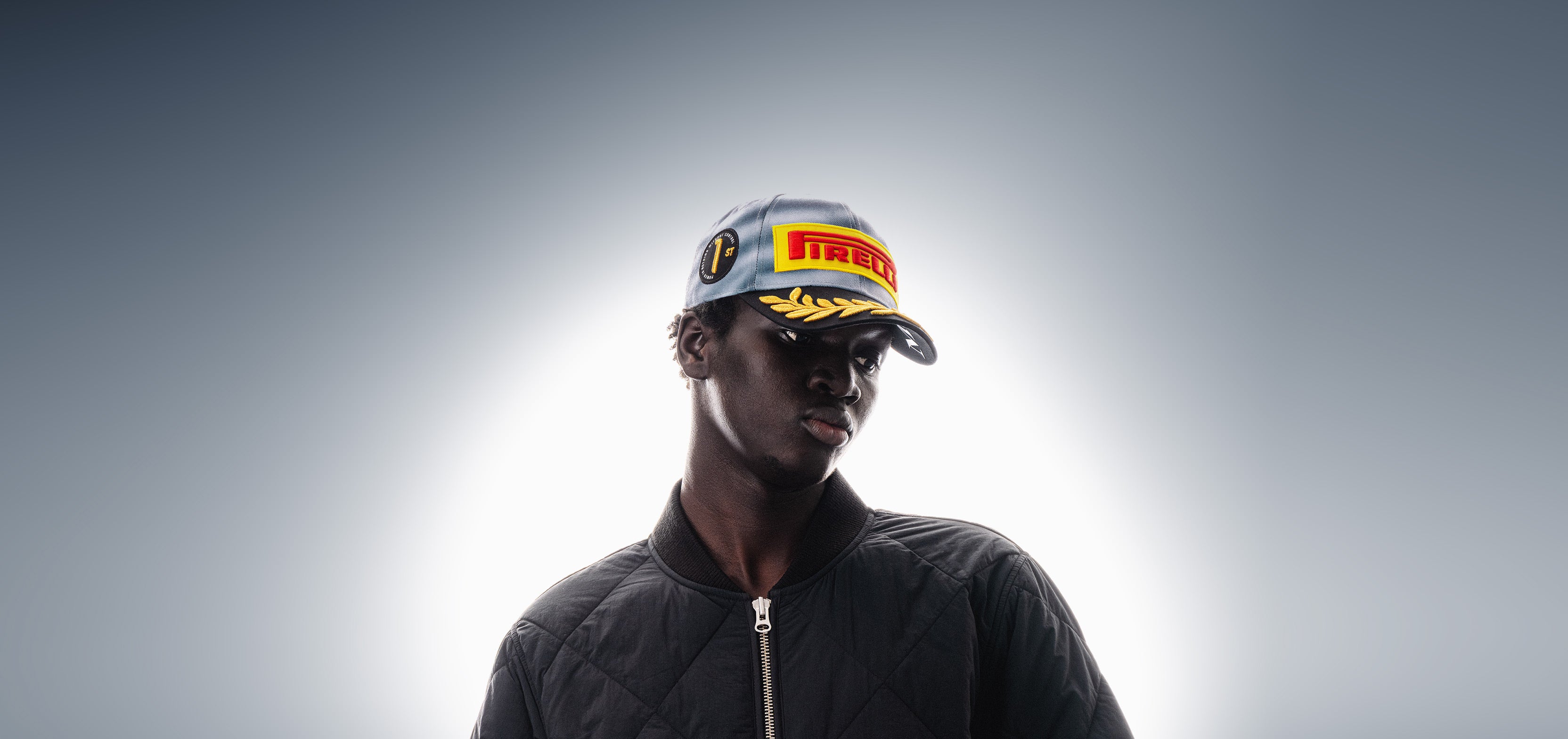 Person wearing an F1® Pirelli Podium Cap 2026 Miami