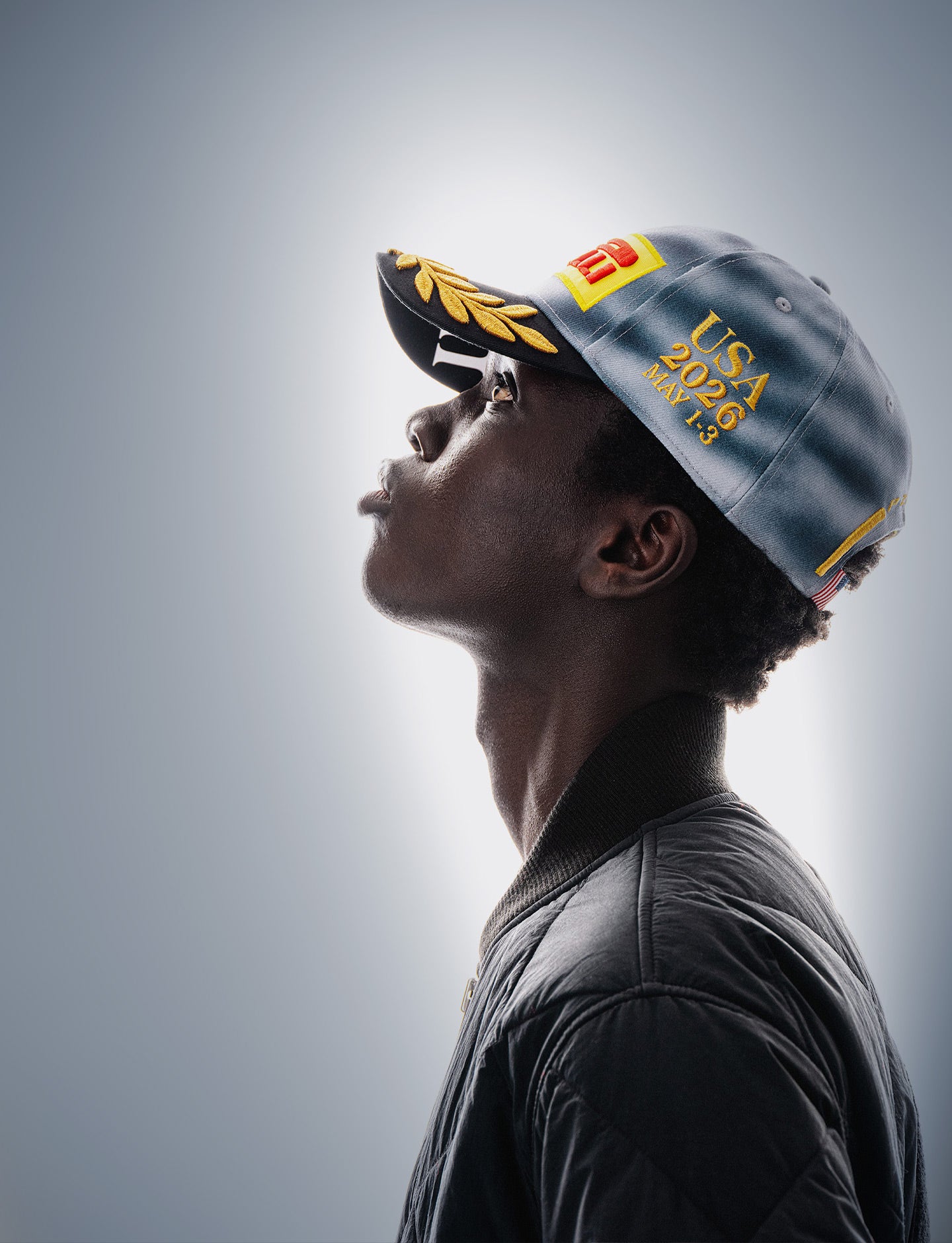 Person wearing a Pirelli Miami 2026 cap against a gray background