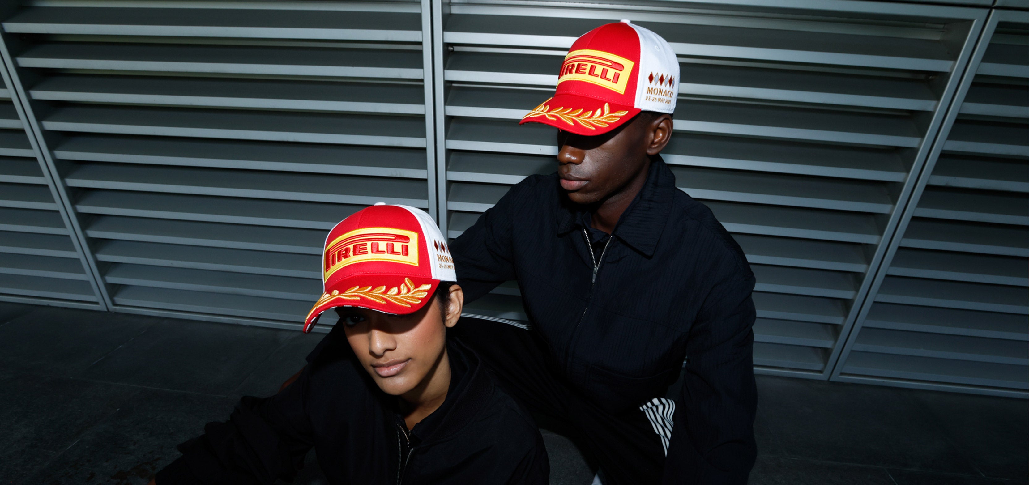 man and woman in red & white Pirelli Podium cap