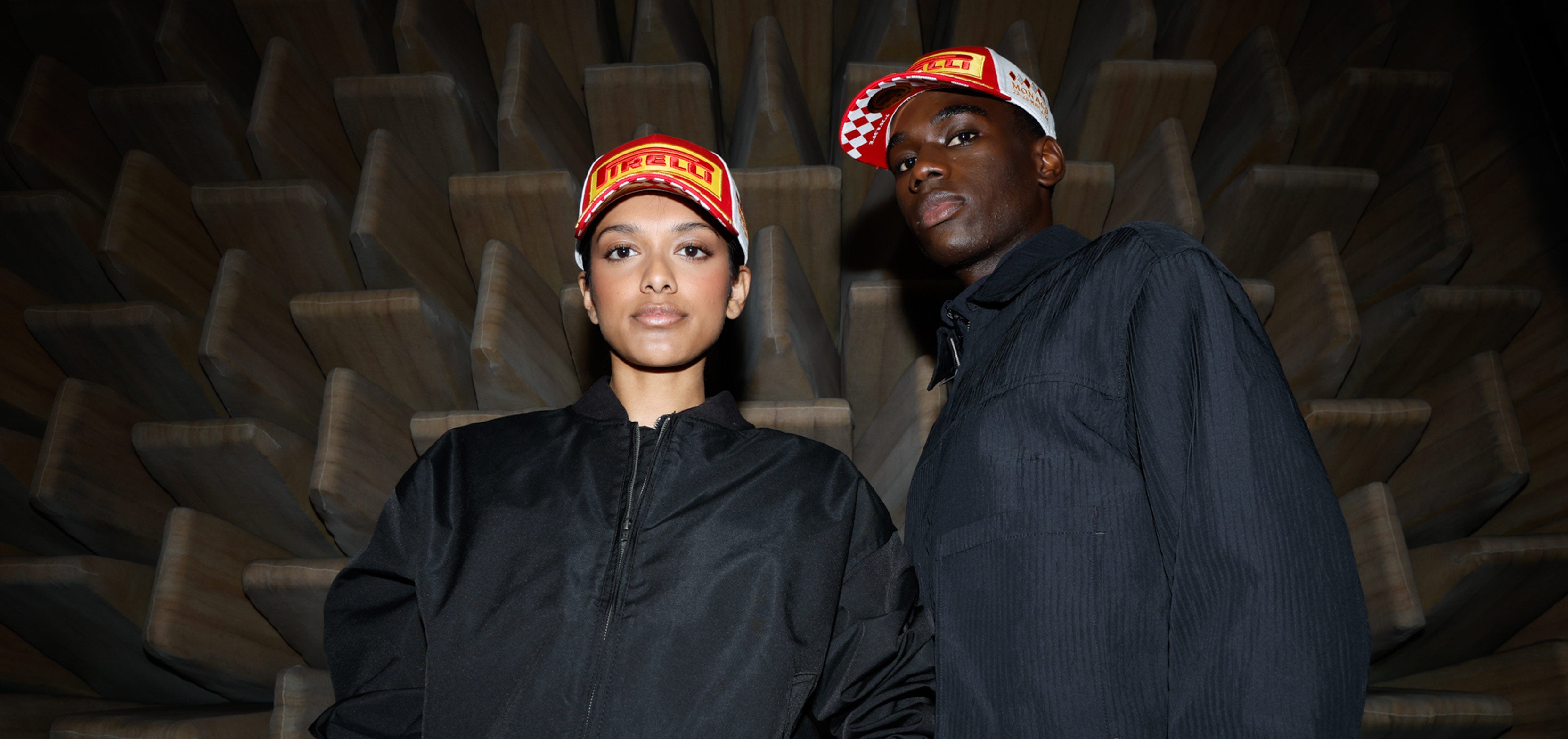 man and woman in red & white Pirelli Podium cap