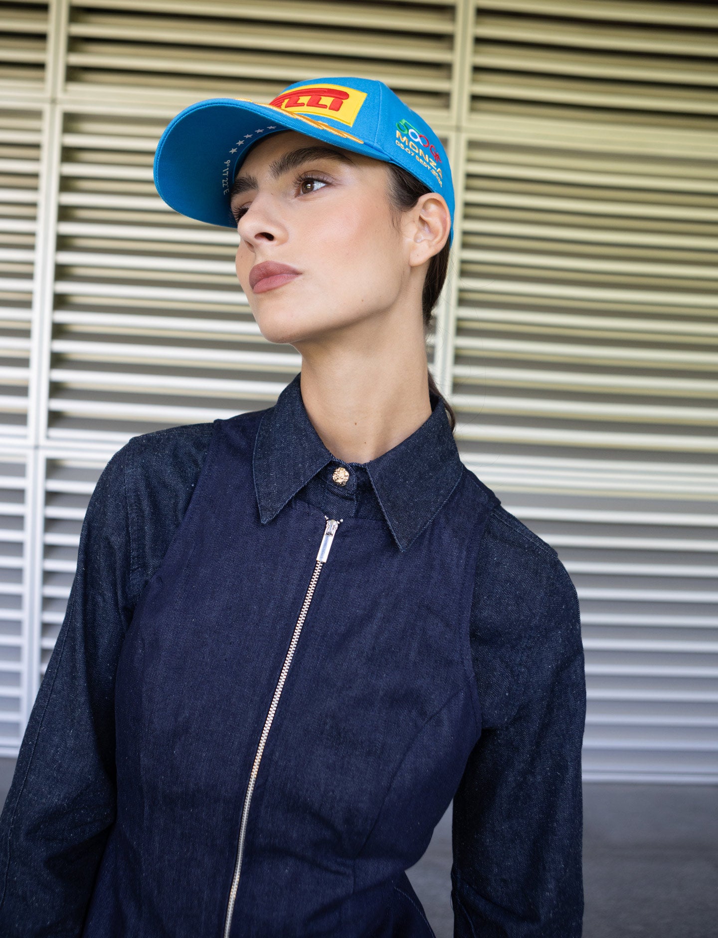 Woman wearing blue Monza Pirelli Podium Cap