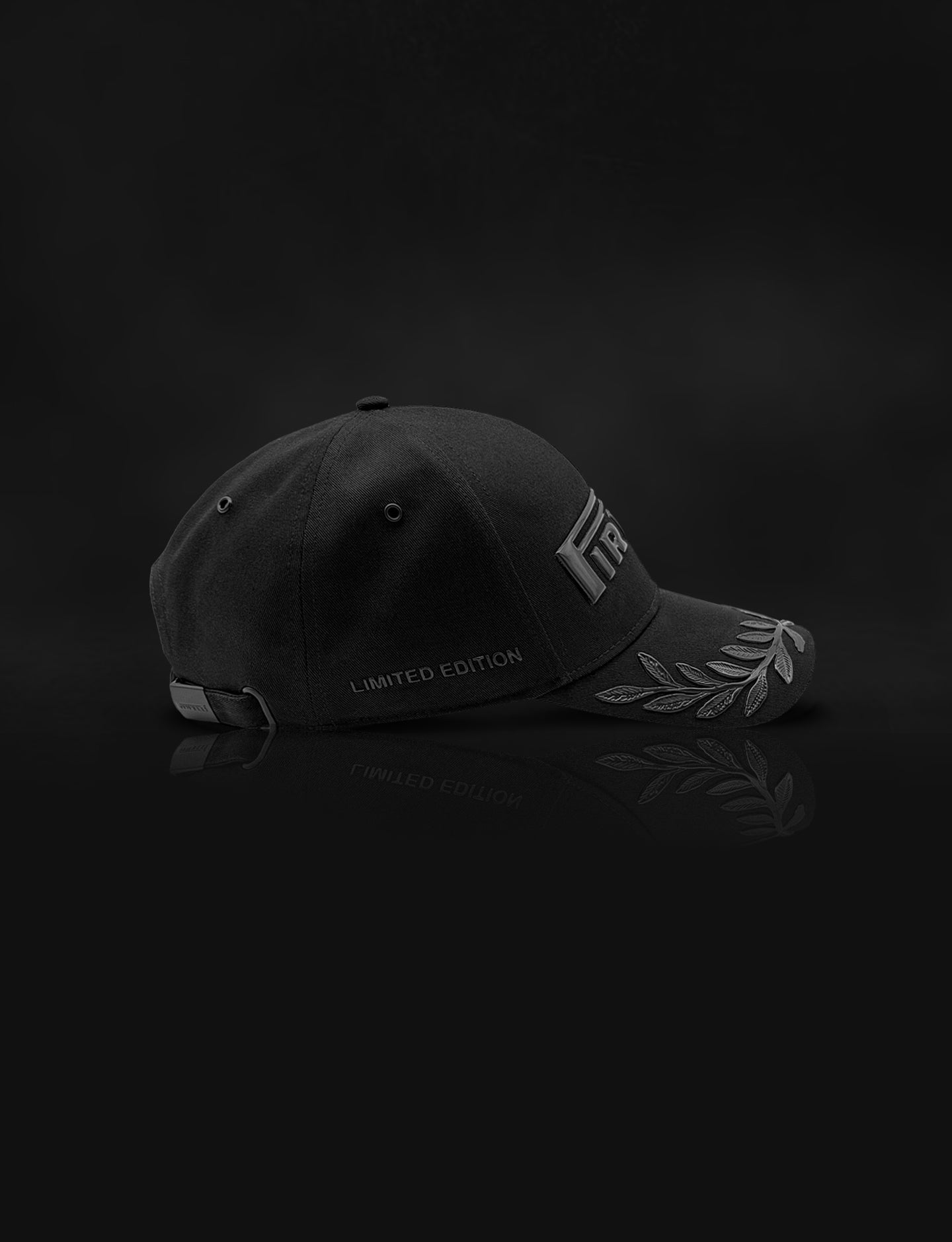 black-on-black Pirelli Podium Cap F1® "Nights Out" against a black smokey background