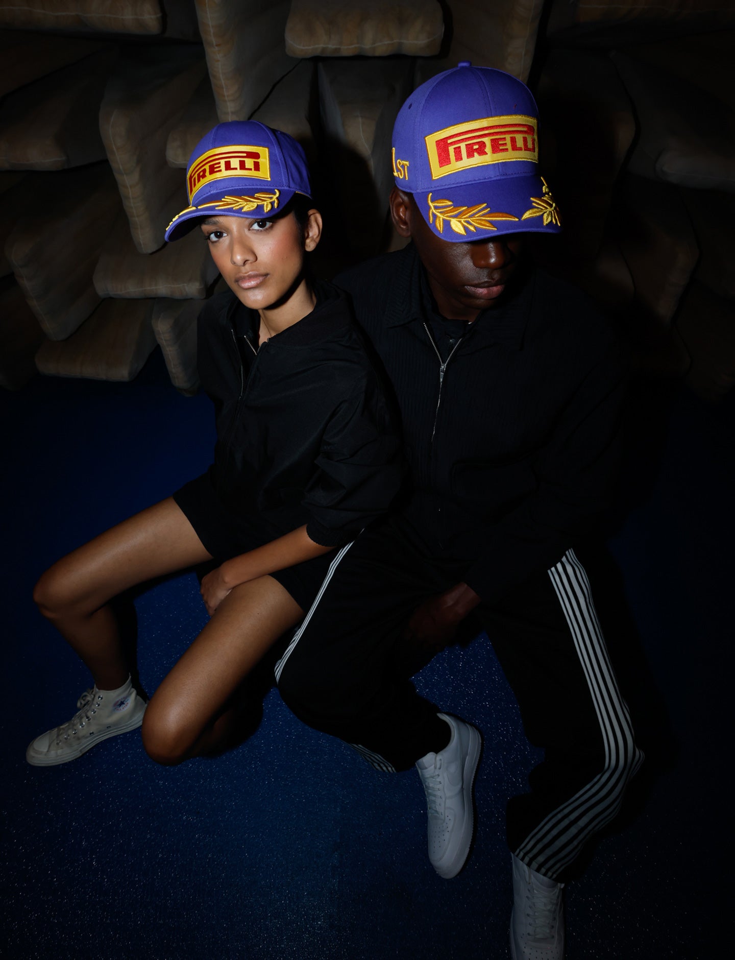 man and woman in purple Pirelli Podium Cap