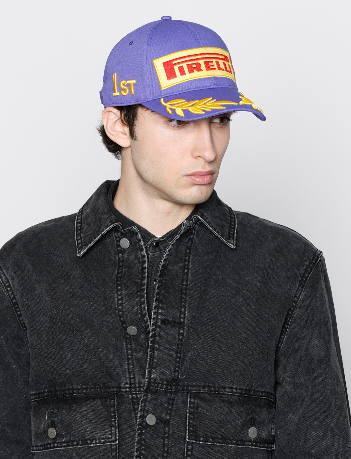 man in purple Pirelli Podium Cap
