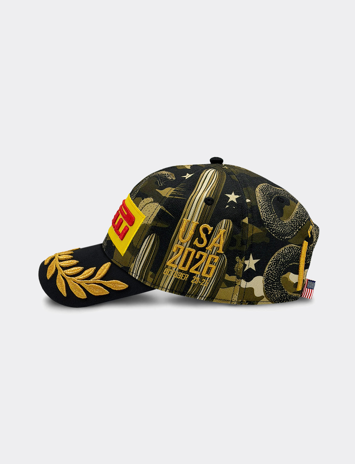 Pirelli Podium Cap 2026 Austin featuring a black and olive green camouflage pattern with gold cactus graphics, white stars, a gold laurel leaf on the brim, and a red and yellow patch on the side.