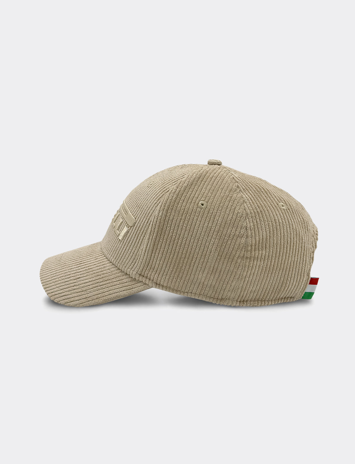 A beige Pirelli corduroy baseball cap shown from a side profile view against a light gray background.