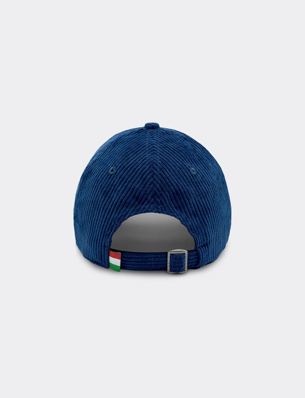 A blue Pirelli corduroy baseball cap shown from the back, featuring a small Italian flag tag and a silver metal buckle on the adjustable strap, set against a light gray background.