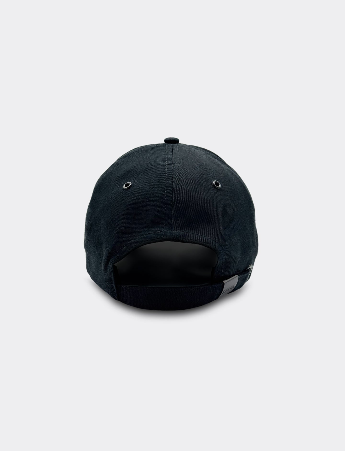 Black cap with a Pirelli logo on a light gray background