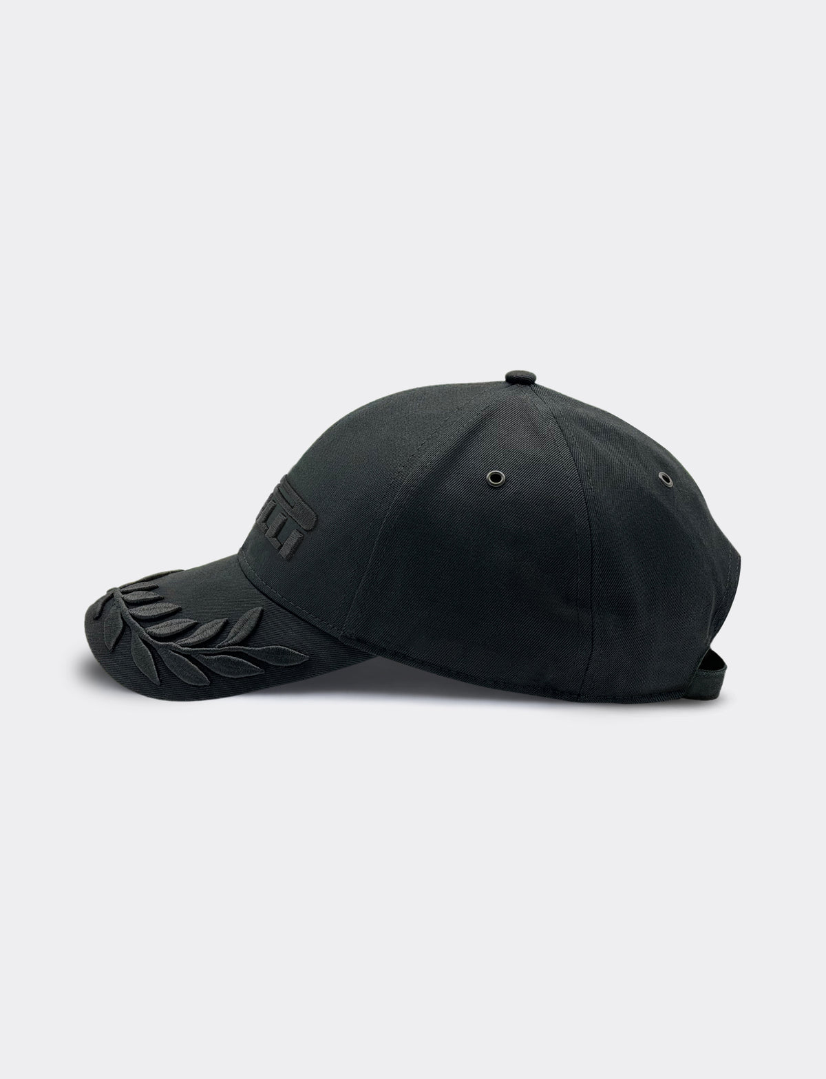 Black cap with a Pirelli logo on a light gray background