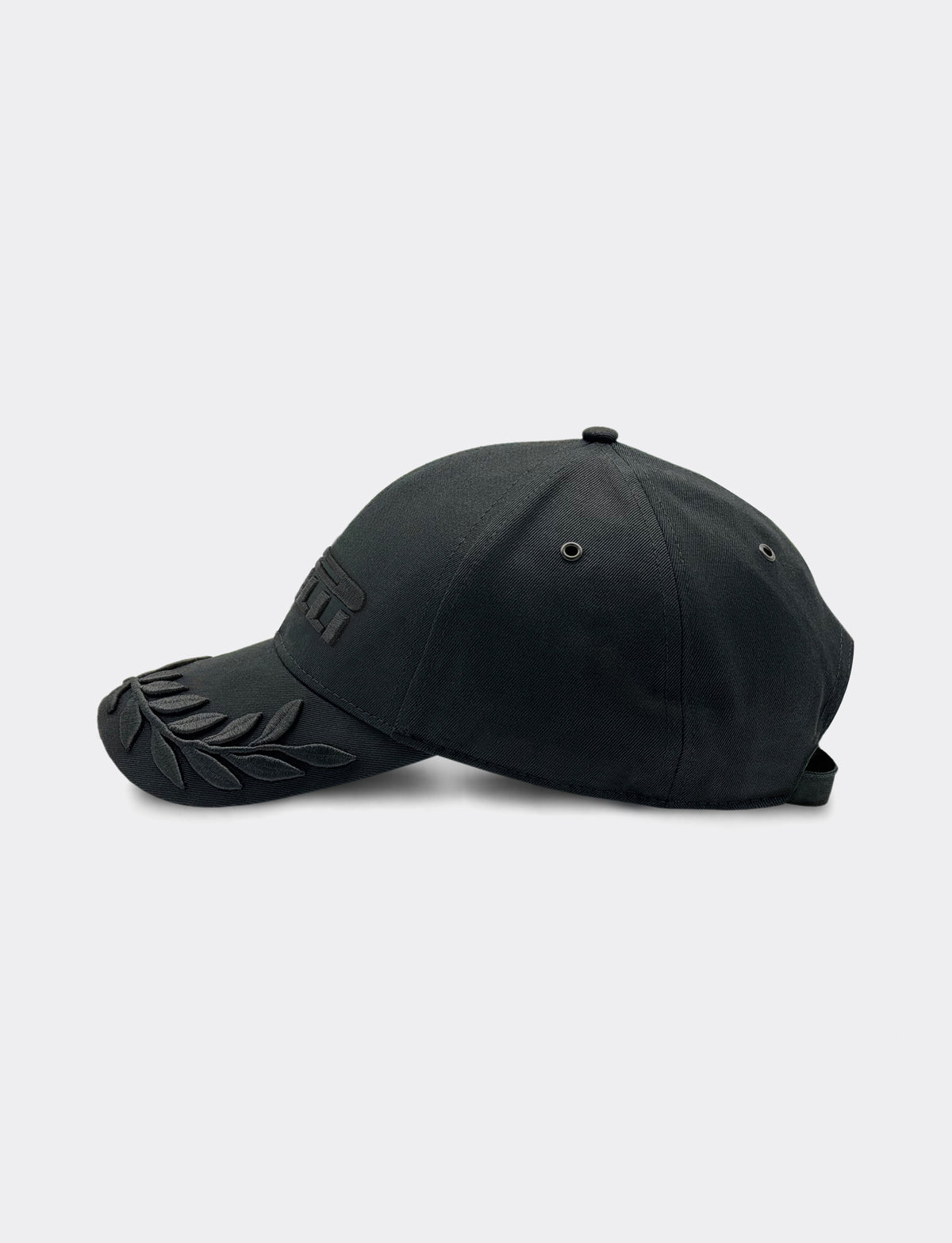 Black cap with a Pirelli logo on a light gray background