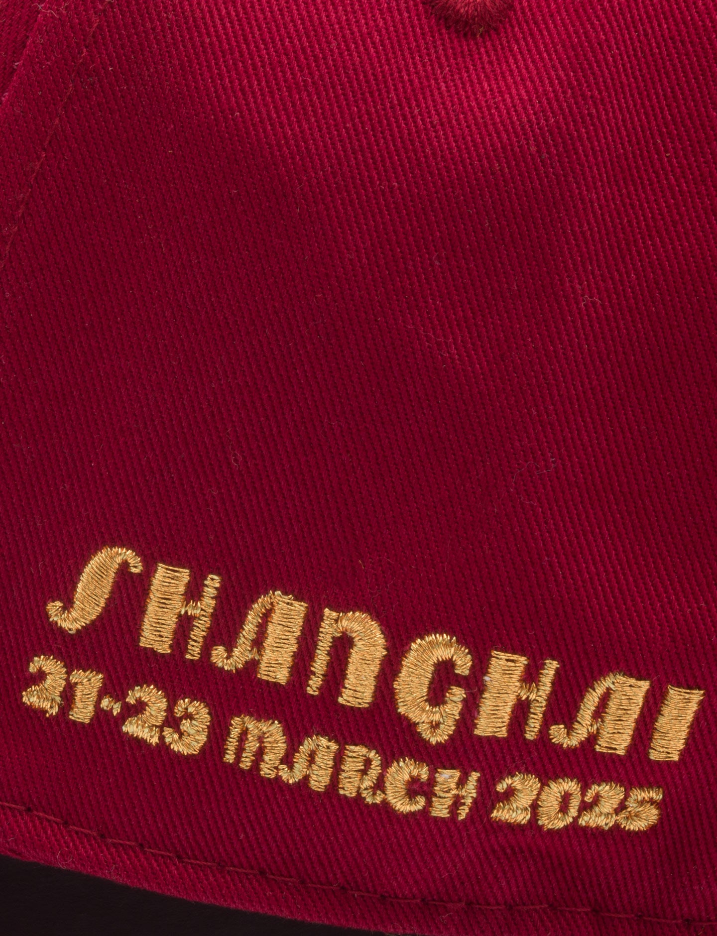 Shanghai and race dates on red cap