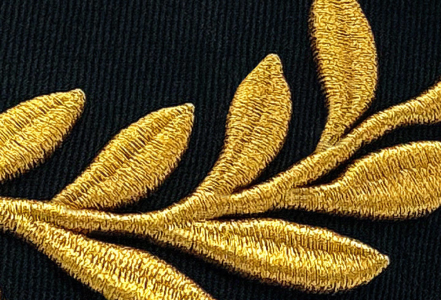 closeup of gold embroidered laurel leaves Pirelli Podium Cap
