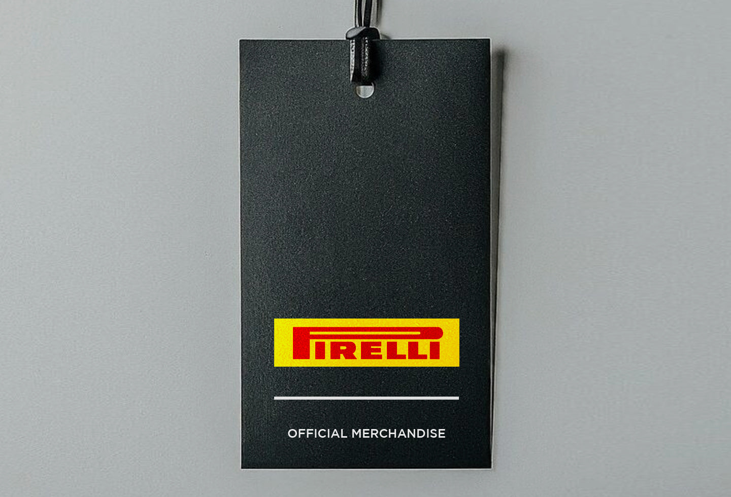 Pirelli official merchandise tag on a gray background
