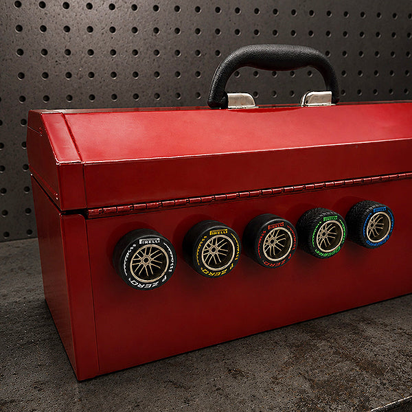 5 Pirelli tyre magnets on a red metal toolbox
