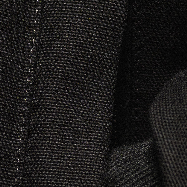Close-up of black textured fabric with a focus on texture and pattern.