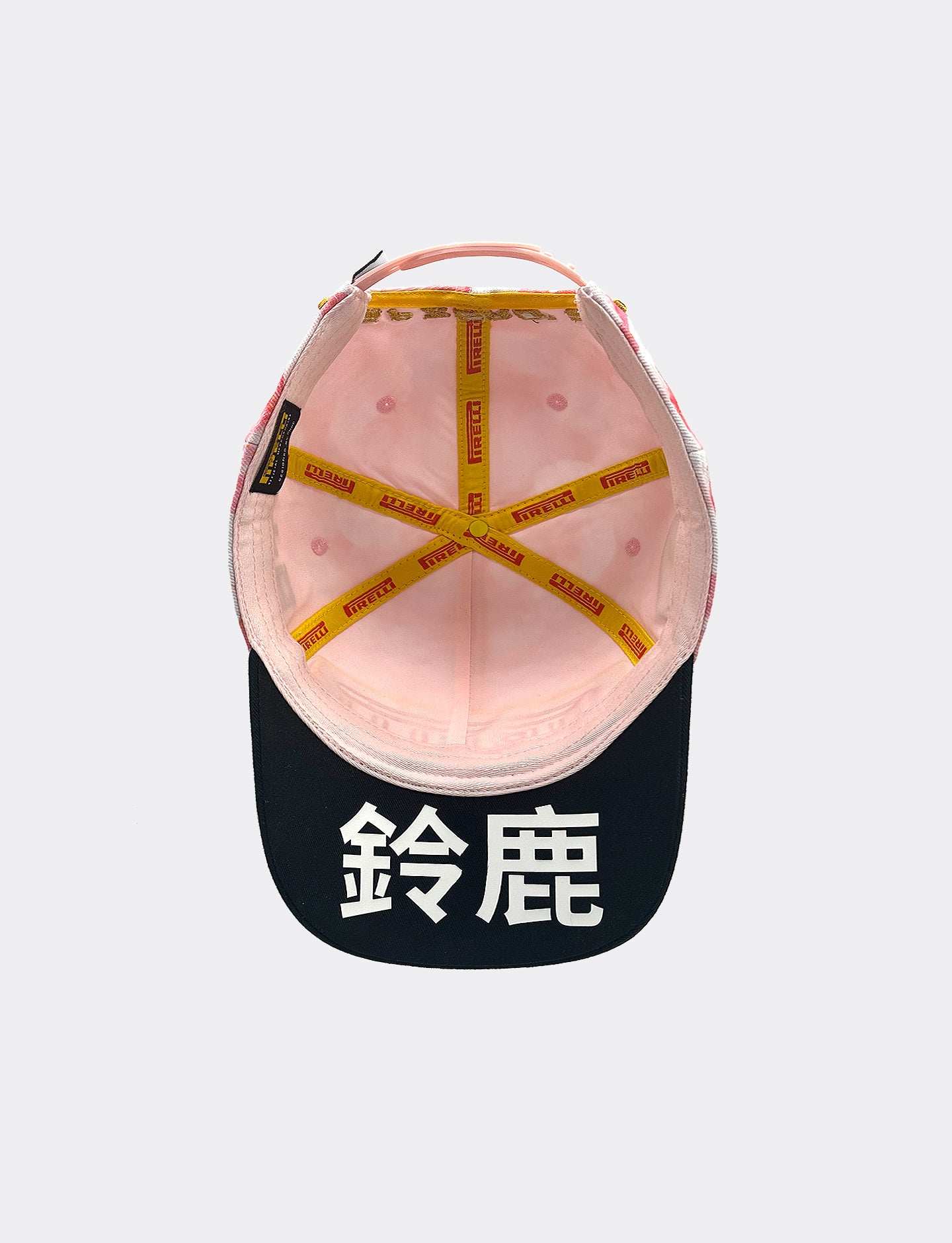 Pink Pirelli cap from underside on a white background