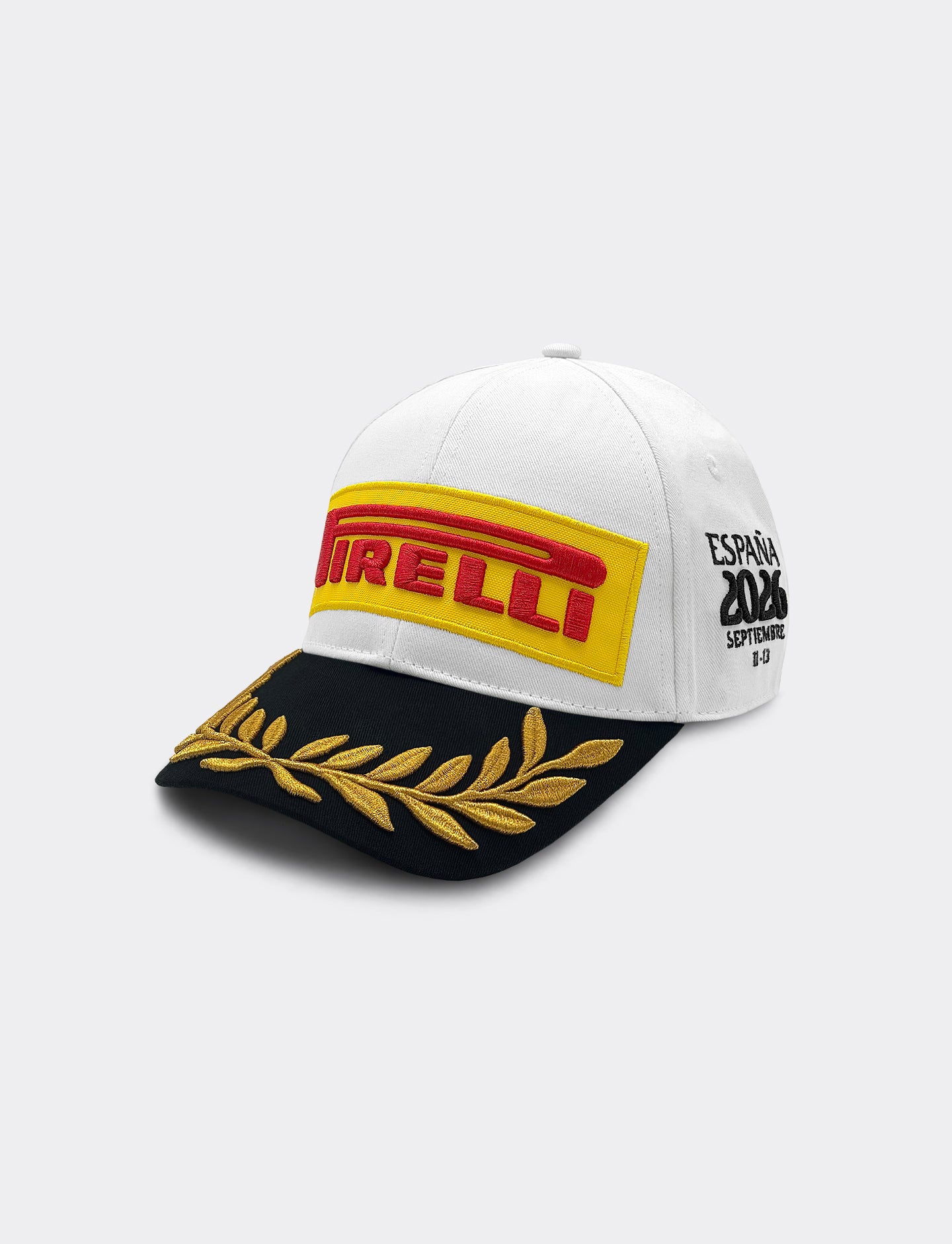 Pirelli Podium Cap 2026 Madrid - left 45 degree angle view, white crown with Pirelli embroidered logo and black visor with gold embroidered laurels