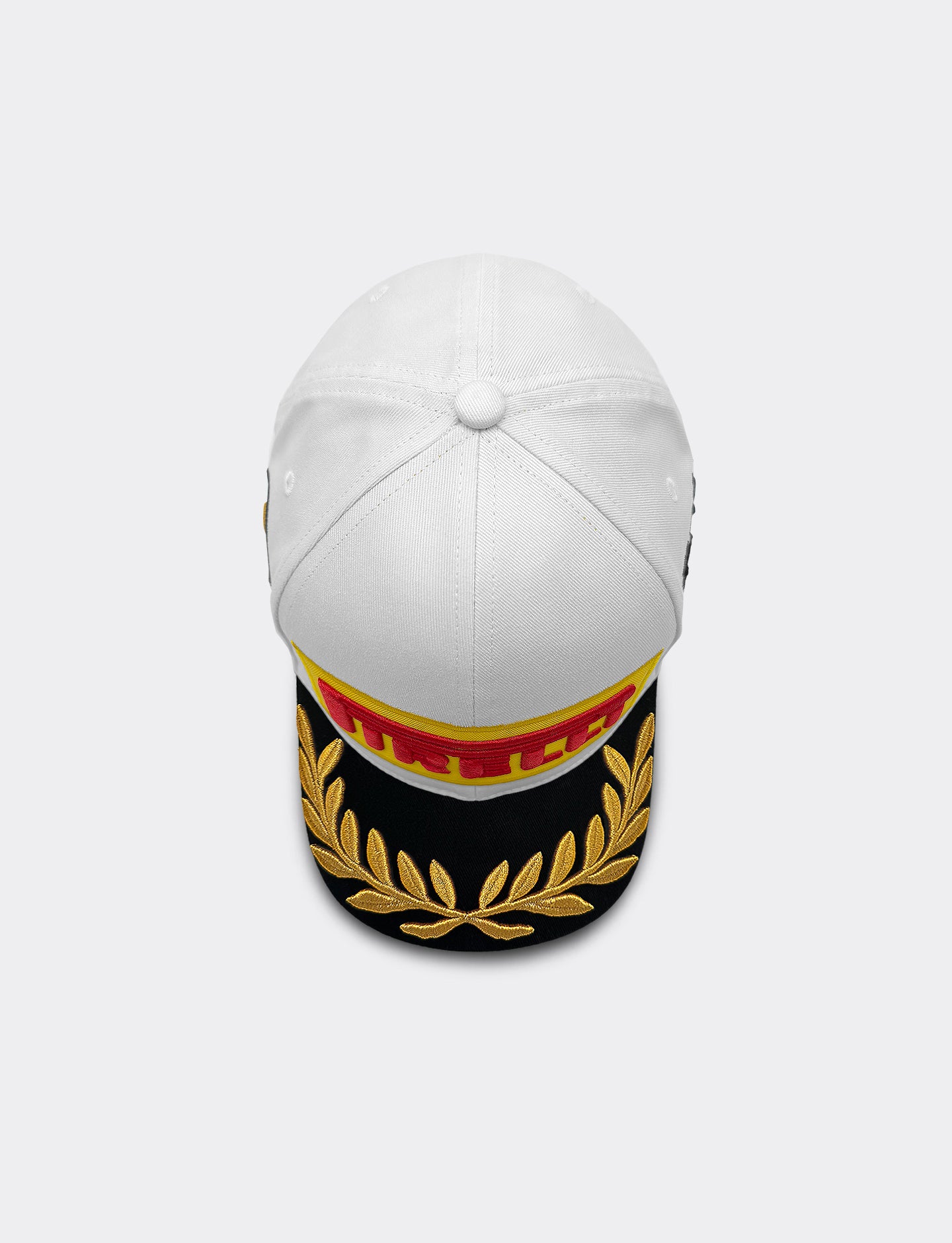 Pirelli Podium Cap 2026 Madrid - top view,  featuring a black visor with gold embroidered laurel wreath and a red and gold Pirelli patch on front