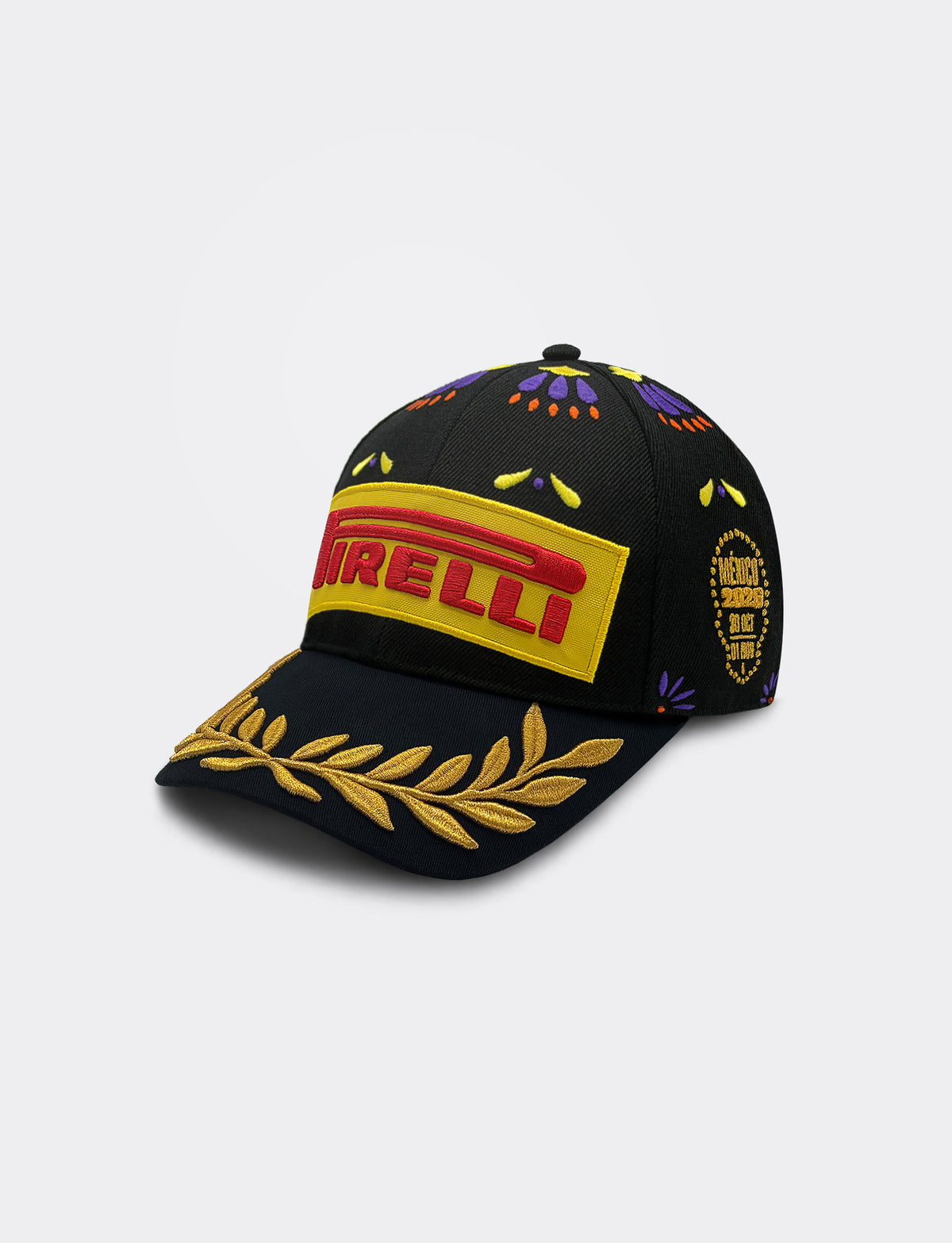 A black Pirelli Podium Cap 2026 Mexico baseball cap featuring a prominent yellow and red embroidered logo on the front, a gold laurel leaf embroidery on the brim, and multicolor geometric patterns on the crown.