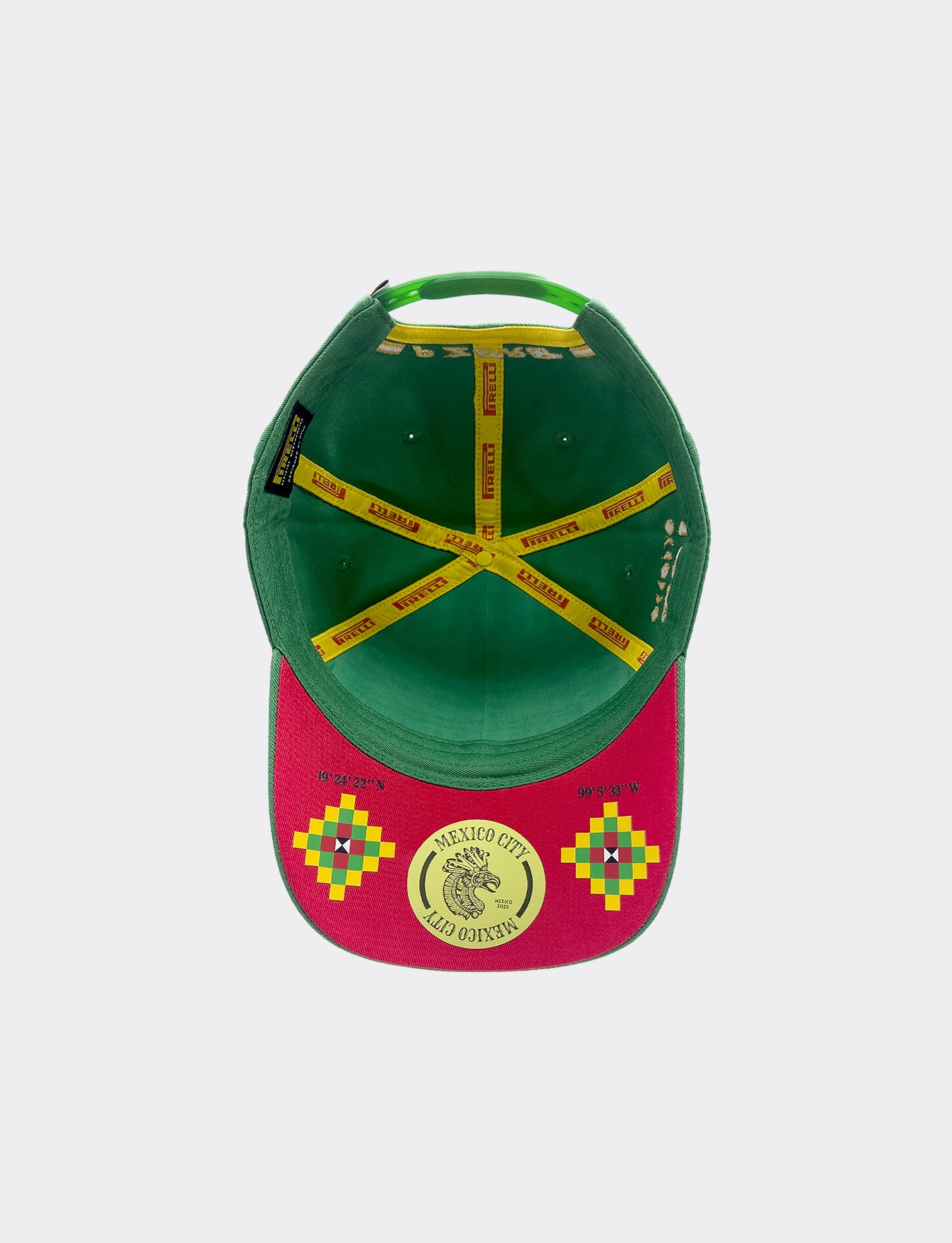 Green and red cap with yellow and multicolor designs on a white background
