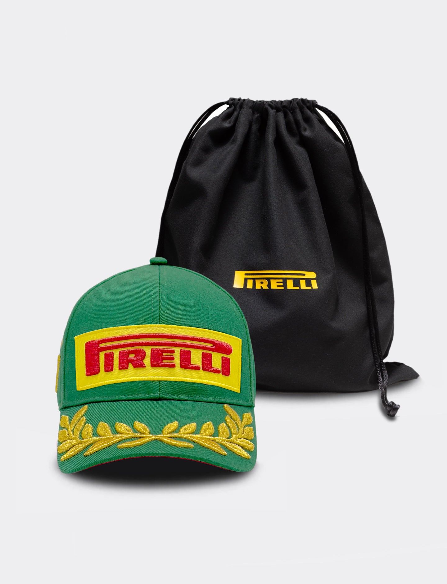 Green cap with Pirelli logo and black drawstring bag on a light gray background