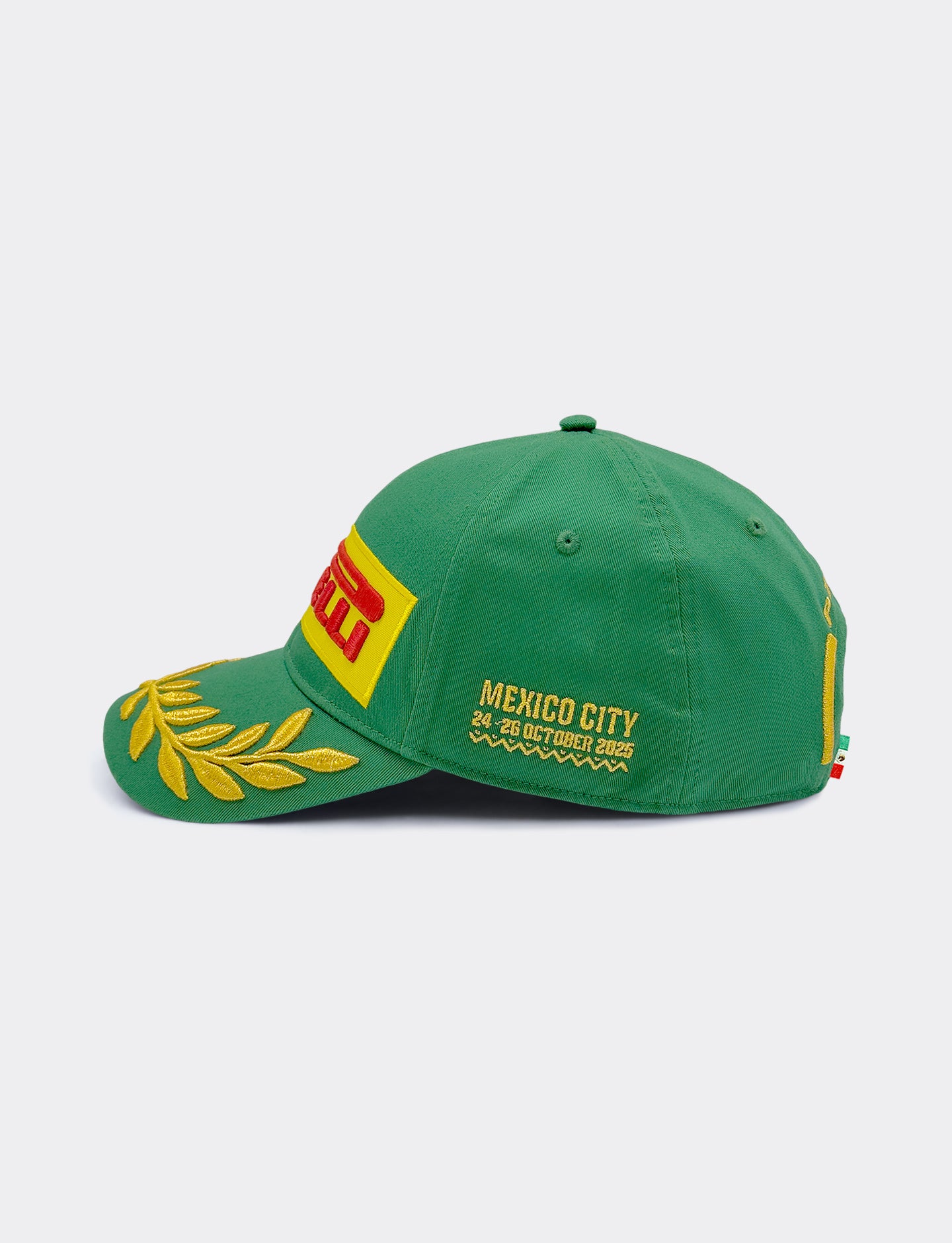 Green Pirelli cap with yellow and red details on a white background