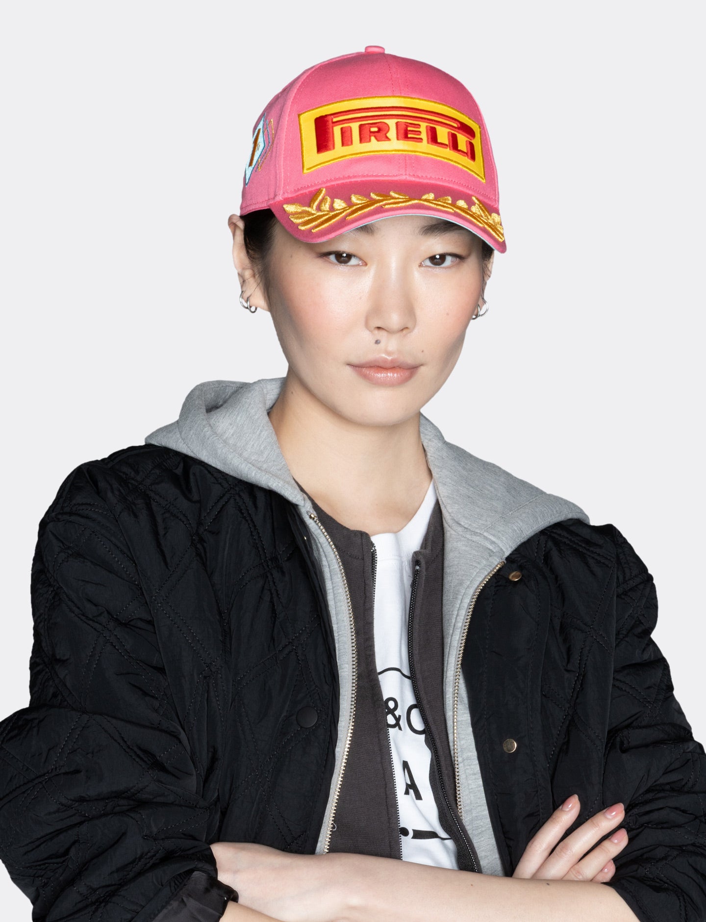 woman in pink Pirelli podium cap