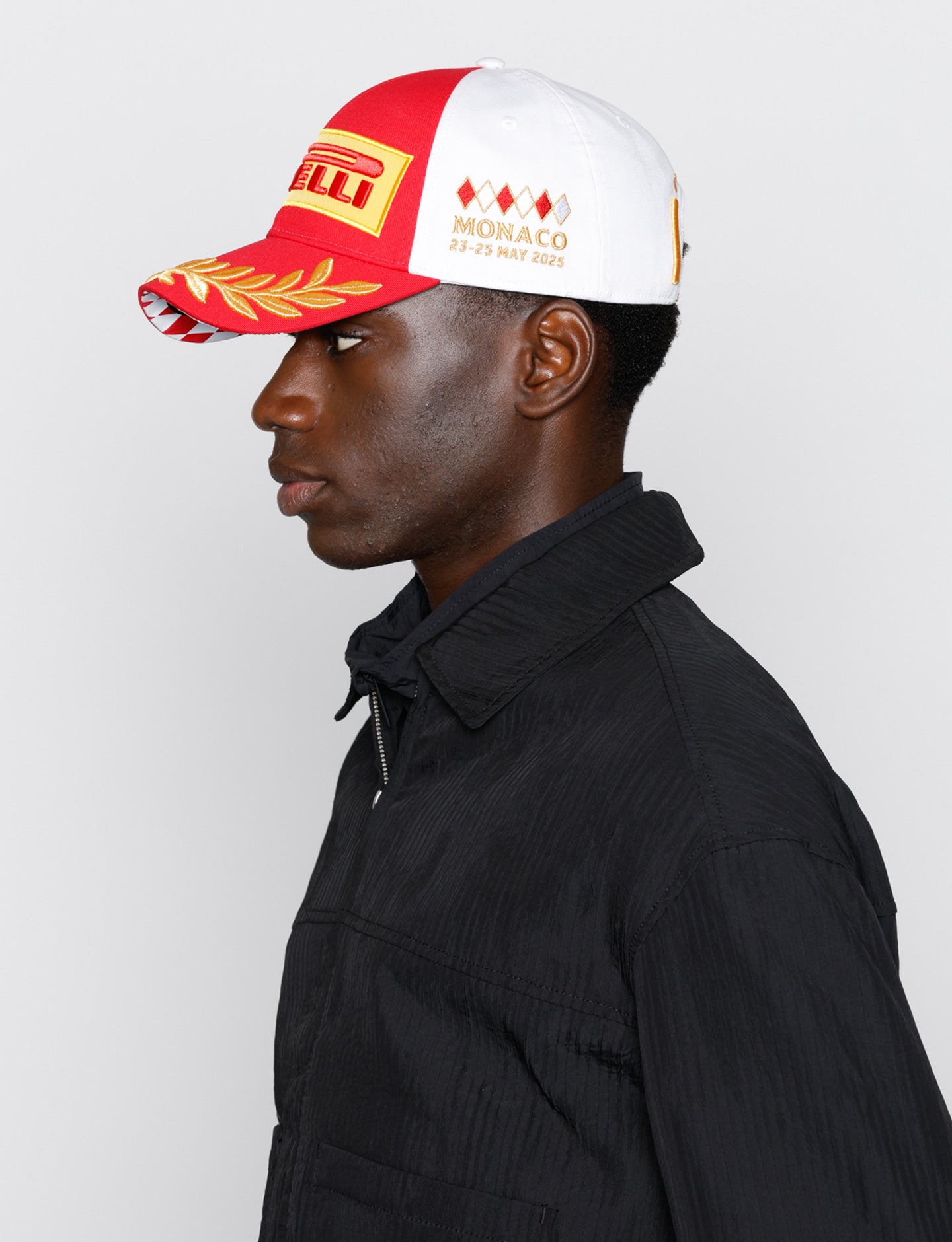 man in red & white Pirelli Podium Cap