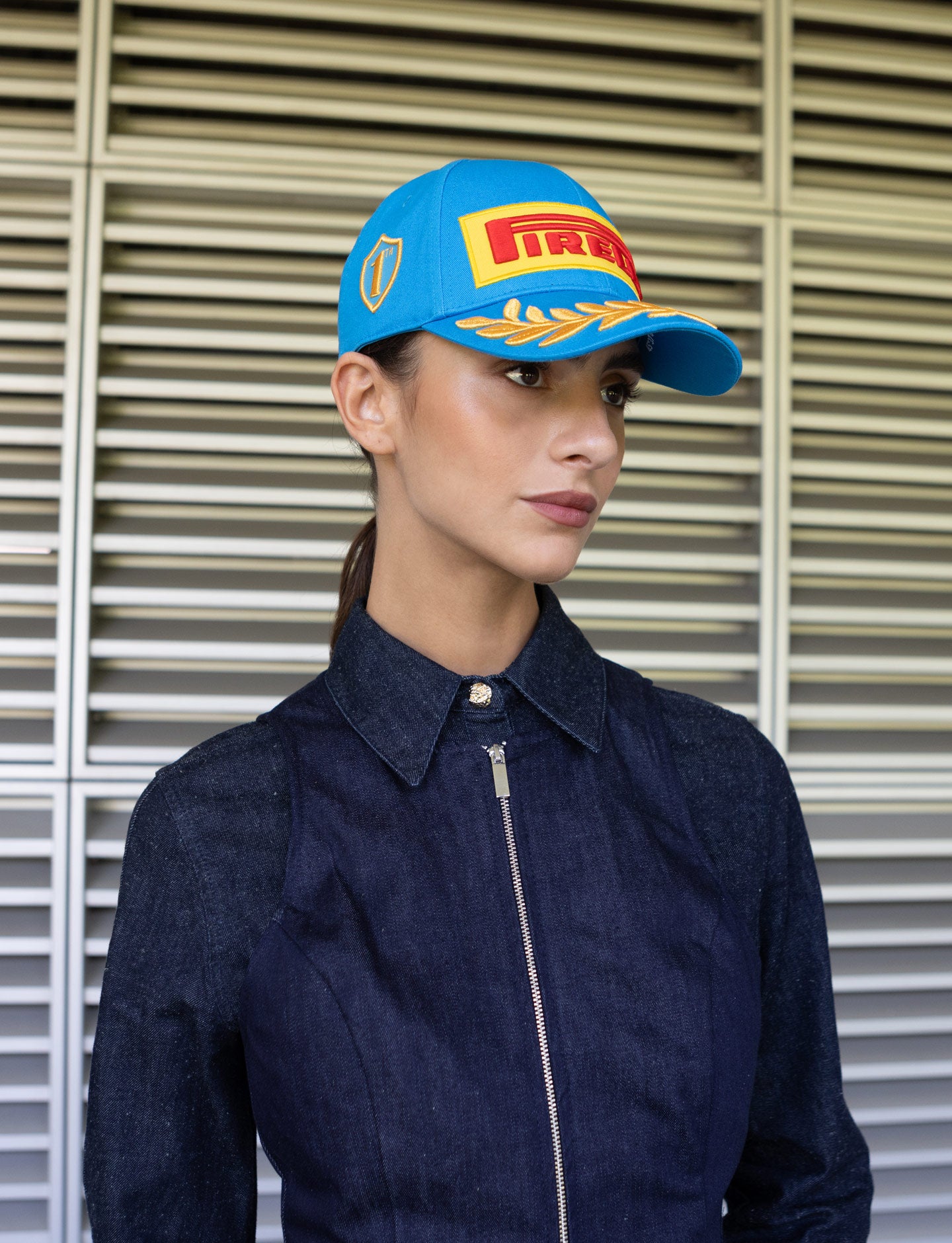 Woman wearing a blue Pirelli cap