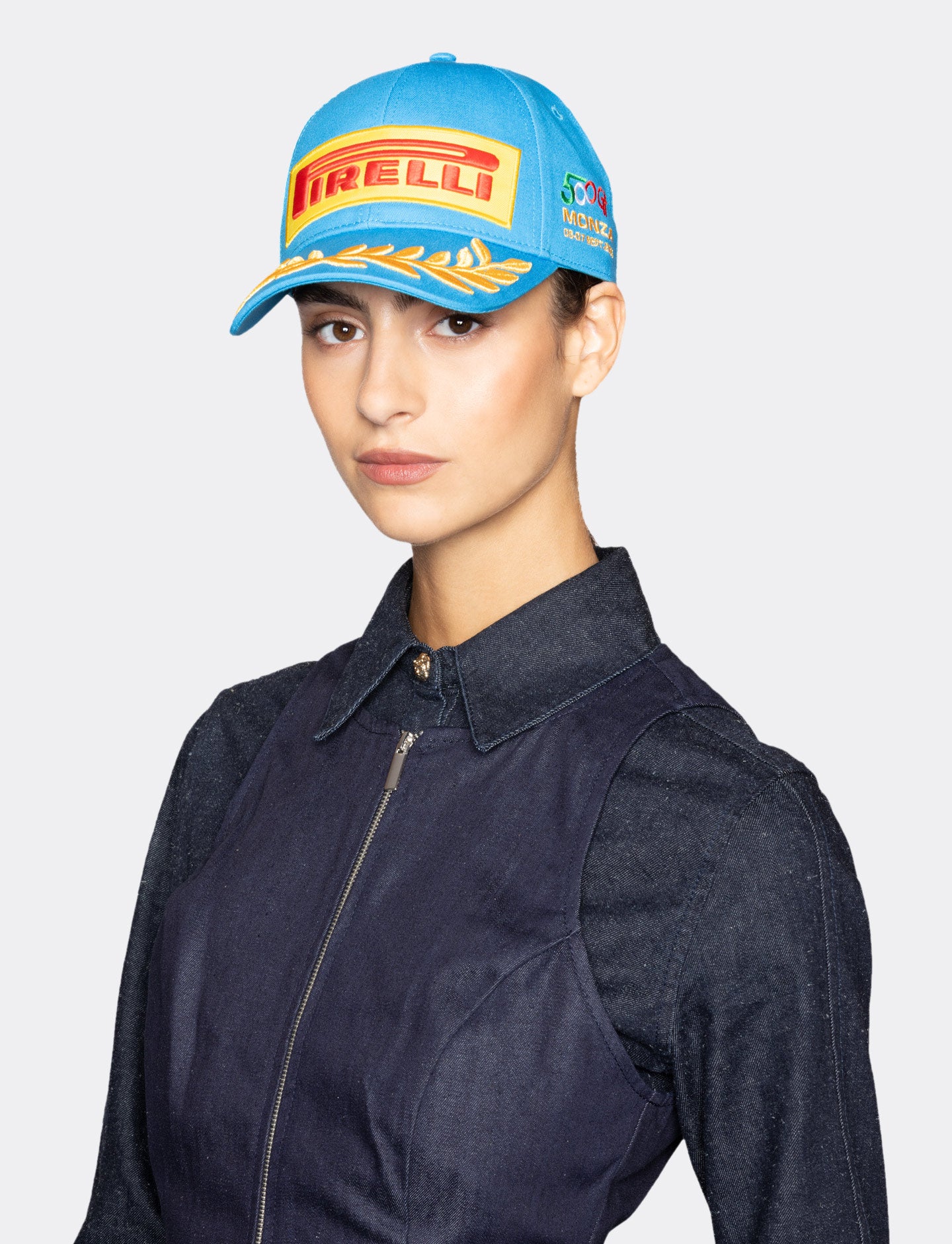 Woman wearing a blue Pirelli cap