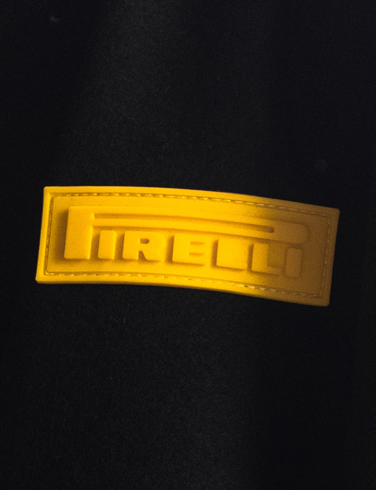 Yellow Pirelli logo on a black background