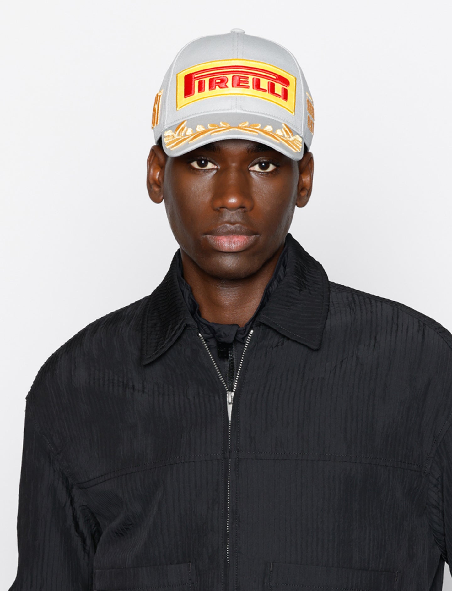 Man in gray Pirelli Podium cap