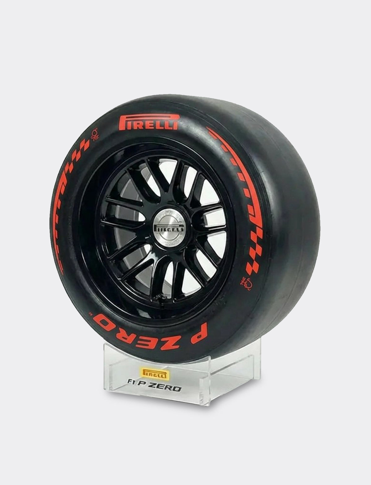 Pirelli racing tire on a stand with a gray background